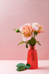 Vase with roses, pink background - 557897506