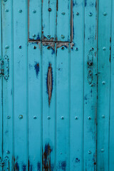 Fototapeta premium Background of Old Blue wooden door in Spain