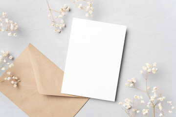 Wedding invitation or greeting card mockup with dry gypsophila flowers