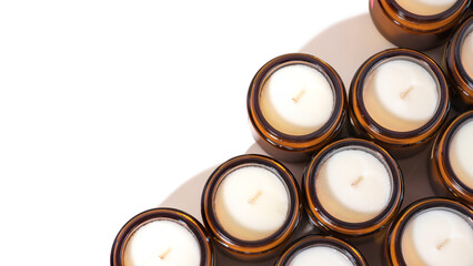 A set of different aroma Soy wax Scented candles in brown glass jars. Natural essential candles in...