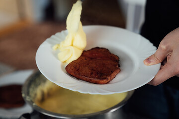 Fried pork ham and mashed potatoes in a bowl