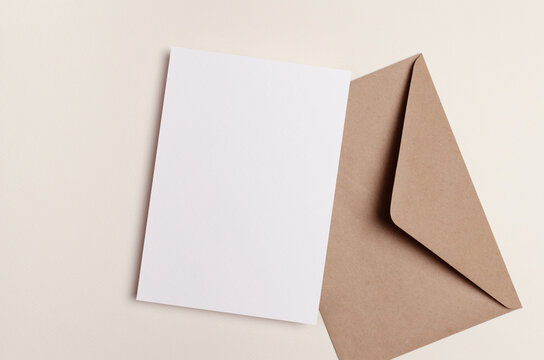Blank paper card mockup with craft envelope
