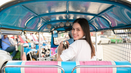 Fototapeta na wymiar Beautiful tourist woman on vacation sightseeing and exploring Bangkok city, Thailand, Holidays and traveling concept
