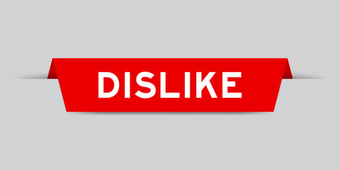 Red color inserted label with word dislike on gray background