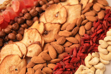 Mix of delicious dried nuts and fruits, closeup