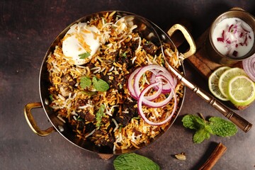 Homemade Goat Fry biryani | Mutton dum biryani served with yogurt raita, selective focus