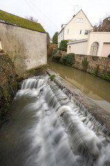 Long exposure of a waterfall on the River Lim walkway in Lyme Regis