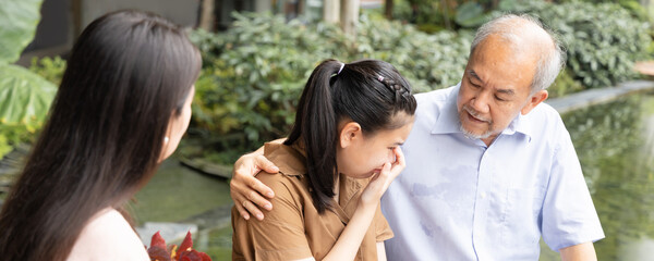 Header crop of Sad teen girl with supporting family of mother and grandfather, strong family and parenting with love concept