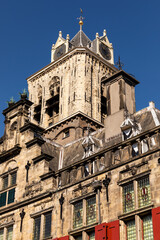 The tower of the old city hall under a blue sky in Delft, Netherlands 