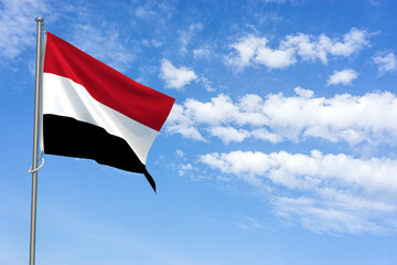 Republic of Yemen Flag Over Blue Sky Background. 3D Illustration