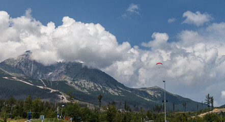 Mountain panorama with paraglider