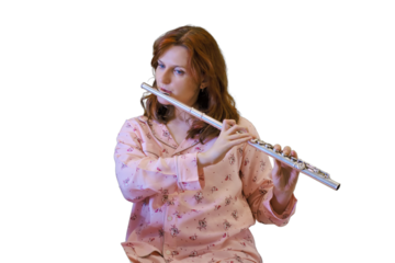Recording an online flute lesson from your home kitchen, isolated on a white background. Woman plays a musical wind instrument while looking at her phone in quarantine