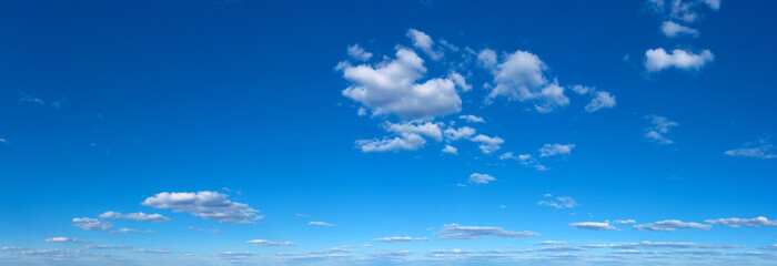 Fototapeta na wymiar Blue Sky background with tiny Clouds. Panorama background
