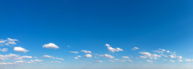 Blue Sky background with tiny Clouds. Panorama background