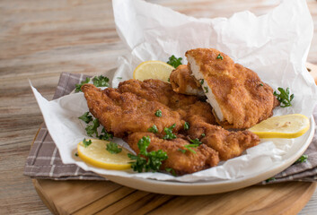 Plate with fresh pan fried chicken schnitzels