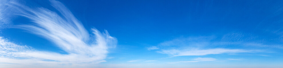 Blue Sky background with tiny Clouds. Panorama background