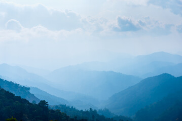 Mountain in fog, mountain ridge and valley with morning sky landscape.