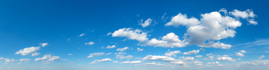 Fototapeta na wymiar Blue Sky background with tiny Clouds. Panorama background