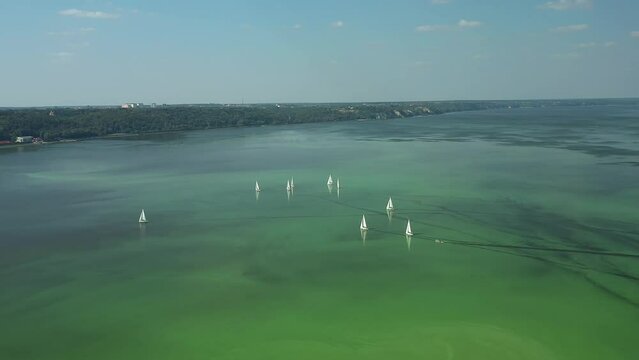 Kyiv, Ukraine, 20.09.2020.  Sailing regatta on yachts on a beautiful sunny day. Kiev Sea, drone video 4K.
