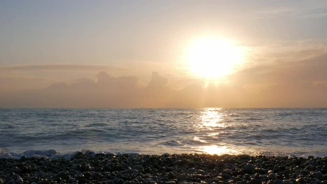 Bright sunrise and the peaceful sea.