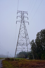 High voltage electric power line in fog