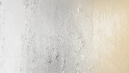 weathered and aged concrete wall, paint mostly peeled off. cement background of an vintage dirty exfoliating plaster. textured background peeling off white and yellow colour cement.