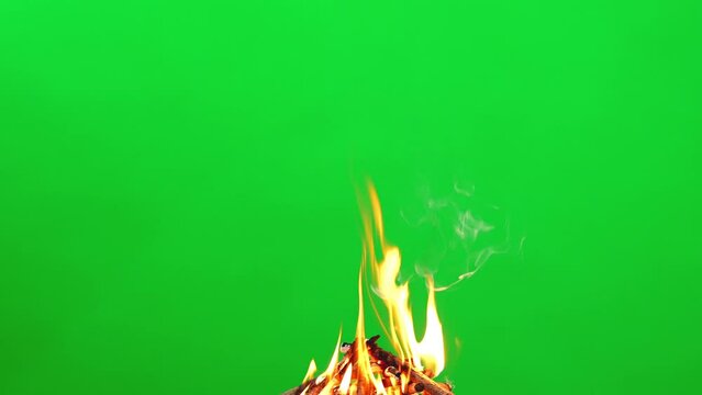 Fire flame burning and glowing on wood slow motion of green screen background