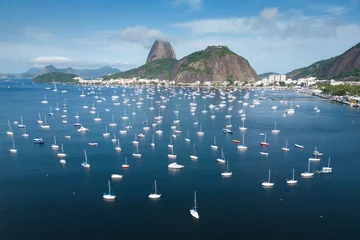 Fotobehang Many Small Boats in Botafogo Bay With Sugarloaf Mountain in the Horizon in Rio de Janeiro, Brazil © Donatas Dabravolskas