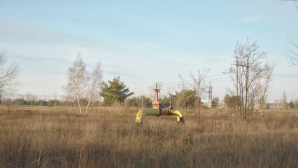 Yellow gas pipe in the field