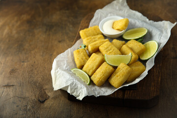 Homemade fish nuggets with lime