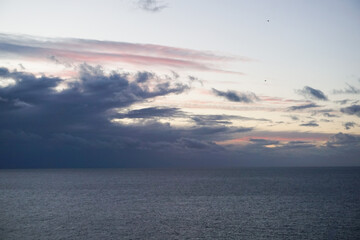 Fototapeta premium Clouds over the sea