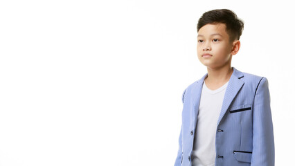 Portrait of an Asian 10-year-old boy in a casual suit. Studio shot - 557931149