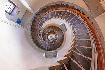 Foto auf Alu-Dibond Vertical view from top of round spiral staircase in lighthouse © Aquarius