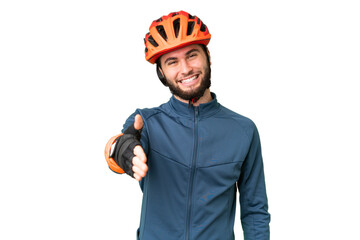 Young cyclist man over isolated chroma key background shaking hands for closing a good deal - obrazy, fototapety, plakaty