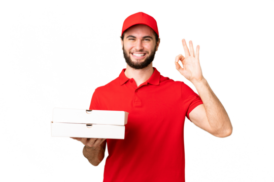 pizza delivery man with work uniform picking up pizza boxes over isolated chroma key background showing ok sign with fingers