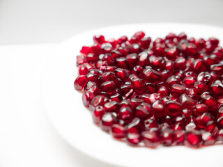 pomegranate fruit berries on a white background close-up