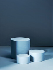 Three blue various sized empty cylindrical pedestals. 3d computer graphic template of displaying...