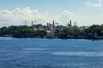 Industrial site on the river banks of Rio Amazonas in Brazil surrounded by the green rainforest