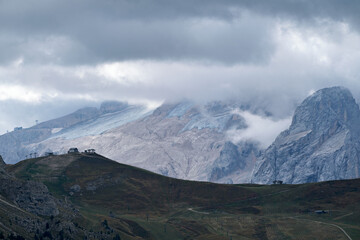 Great view of the Dolomites mountains with the glacier of the Marmolada in the background and a fantastic light and clouds condition, South Tyrol, Italy