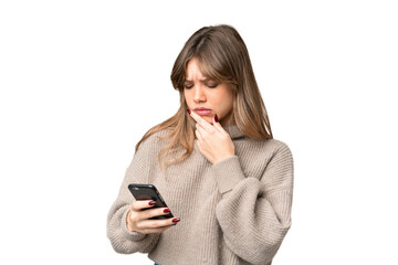Young girl over isolated chroma key background thinking and sending a message