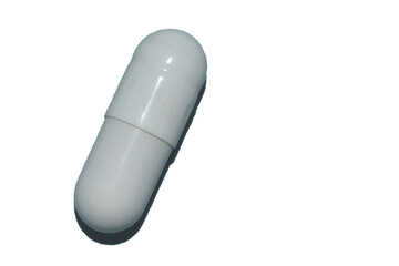 pills in a capsule close-up isolated on white