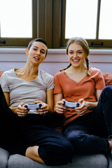 LGBTQ lesbian couple playing video game