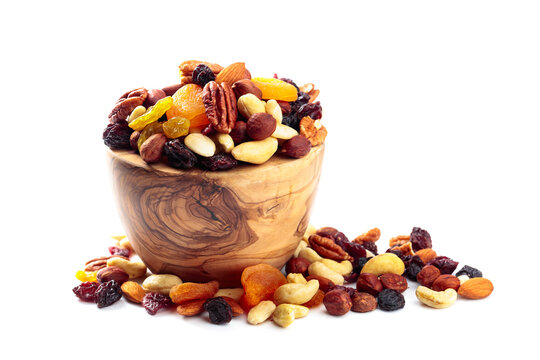 Mix of nuts and dried fruits isolated on a white background.