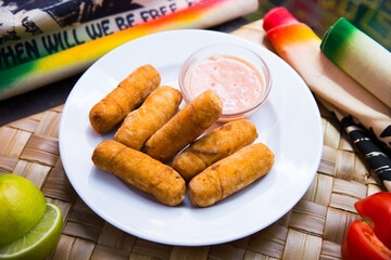 Tequeño is a fried breaded cheese stick or bread dough spear with white cheese stuffed in the middle, and is a popular meal or snack in Chile.