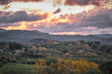 Fototapeta na wymiar Autumnal landscape at sunset of tuscan countryside in Mugello