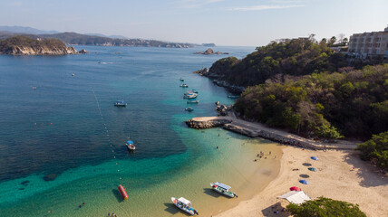 Bah&iacute;a de Huatulco La Entrega, Oaxaca Mexico, aerial photography with drone. blue colored beach