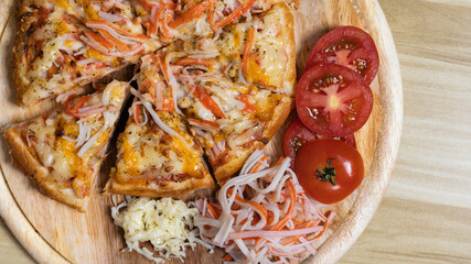 Homemade crab sticks Pizza, Hot pizza big slices of cheese for lunch or dinner topped with crab sticks, Template with delicious, Promotional poster for restaurant or pizza sale, Text space.