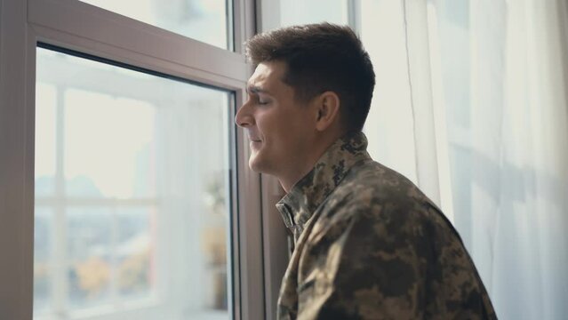 Smiling soldier feeling happy, soon to come home, family reunion expectation