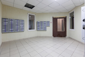 mailboxes in the lobby of an apartment building