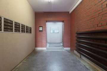 mailboxes in the lobby of an apartment building